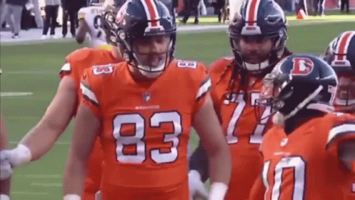 Denver Broncos Football Players Standing On Field GIF