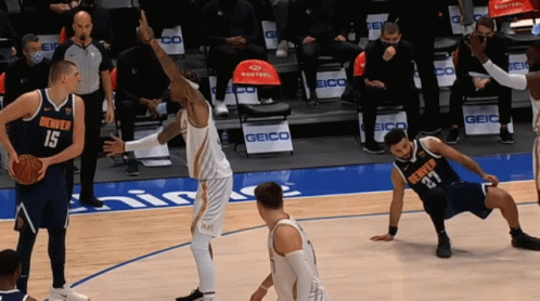 denver players 15 and 27 are playing basketball on a court