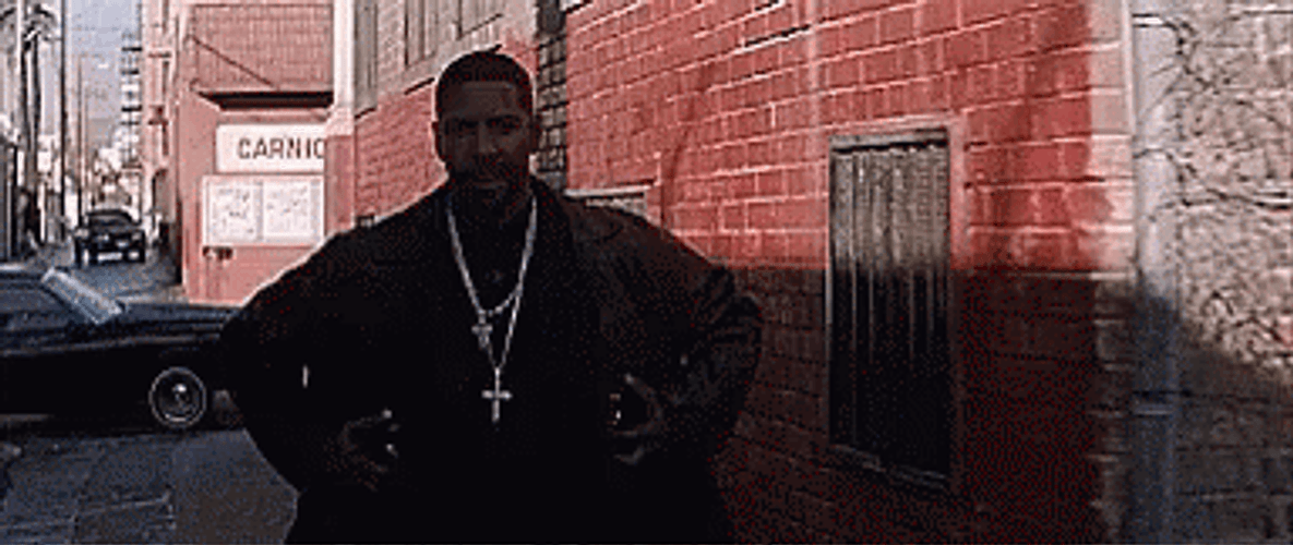 Denzel Washington Hiding Weapons Under Coat GIF