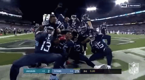 Derrick Henry Stiff Arm Posing With Team GIF