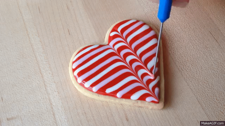 Designing Heart-shaped Red Cookies GIF