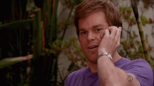 Dexter Morgan Happy Smile Phone Call GIF