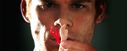 Dexter Morgan Checking Out Doll Hand GIF