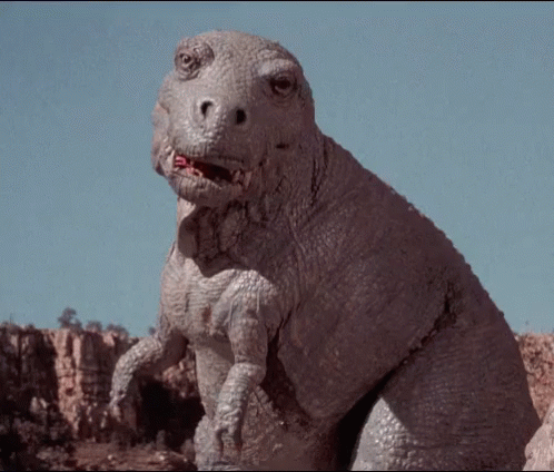 Dinosaur Looking At Camera With Mouth Open GIF