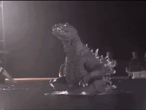 Dinosaur Statue in Dark Room With Basketball Player