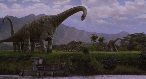 Dinosaurs Standing in Field Near River