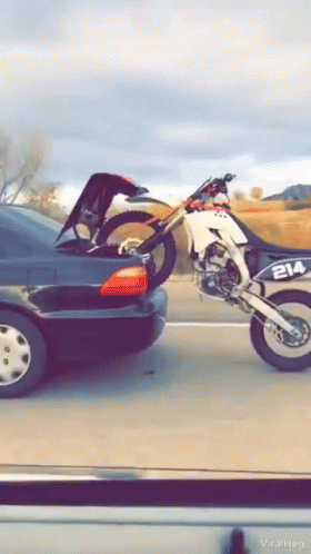 Dirt Bike Piggyback Riding On Car GIF