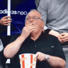 Disappointed Eating Popcorn GIF