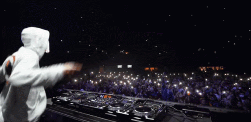DJ Playing Music in Front of Crowd