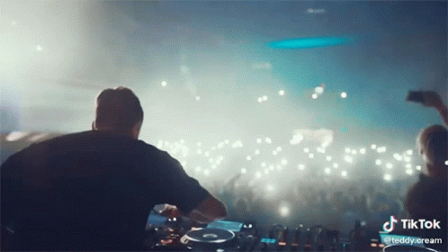 DJ Playing Music In Front Of Crowd With TikTok Logo GIF