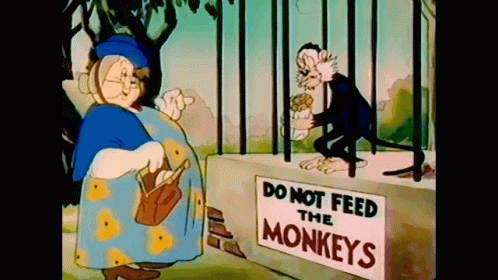 Do Not Feed Monkeys Sign Next To Cartoon Character GIF