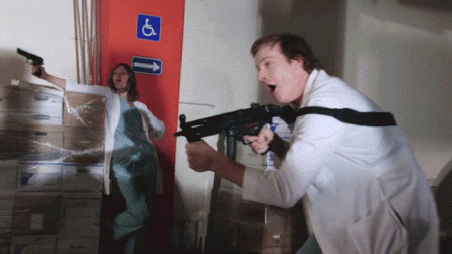 Doctor Firing The Machine Gun GIF