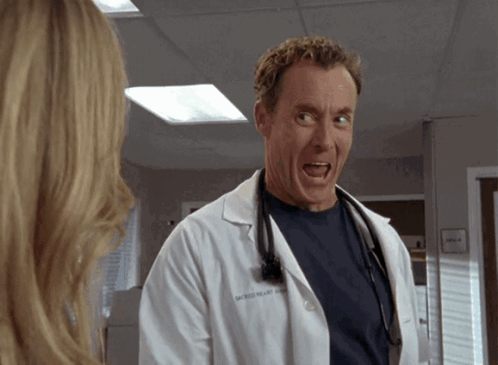 Doctor Michael Williams in White Coat with Stethoscope