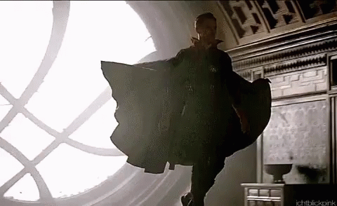 Doctor Strange Is Flying Through The Air In Front Of A Large Window . GIF