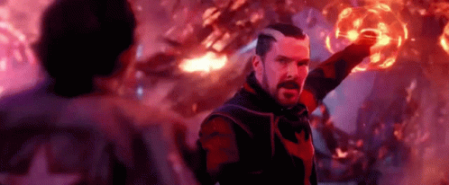 Doctor Strange Is Holding A Red Sphere In His Hand In A Scene From The Movie . GIF