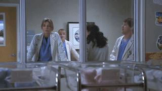 Doctors Standing In Hospital Room Looking Out Window GIF