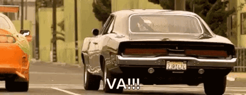 Dodge Charger Next to Orange Car