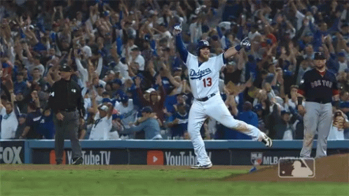 Dodgers Baseball Player Running with Hands Up