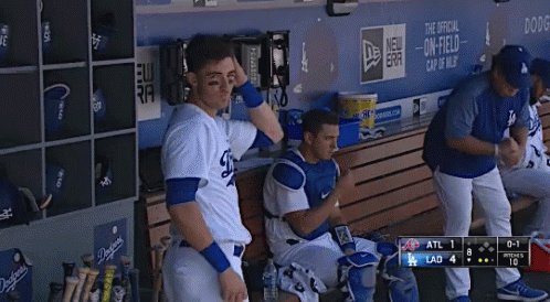 Dodgers Baseball Player Sitting on Bench