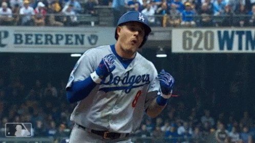 Dodgers Player Celebrating Home Run in Front of 620 WTM Sign