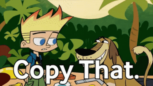 Dog In Orange Shirt Sitting Next To Tomatoes GIF