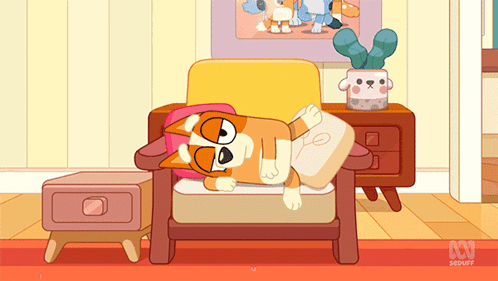 Dog Laying on Chair With ABC Logo