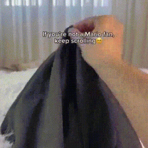 Dog Sitting on Bed With Blanket on Head