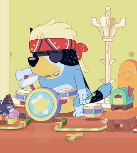 Dog Wearing Sunglasses and Bandana Playing Drums