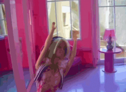 Doll Dancing in Pink Room With Arms Up
