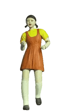 Doll in Red Dress and Yellow Shirt Standing on One Leg
