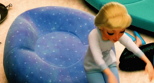 Doll On Blue Bean Bag Chair With Stars GIF