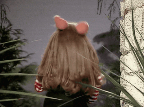 Doll With Long Hair and Pink Ears in Grass
