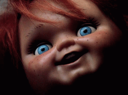 Doll With Red Hair and Blue Eyes Smiling