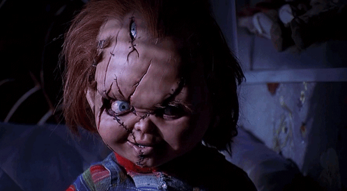 Doll With Stitches on Face in Dark Room