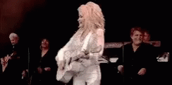 Dolly Parton With Suit And Guitar GIF