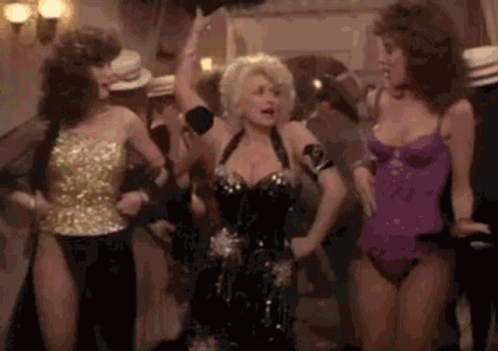 Dolly Parton Dancing With Women in Swimsuits