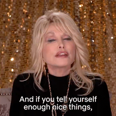 Dolly Parton in Black Top and Gold Necklace Saying And If You Tell Yourself Enough Nice Things