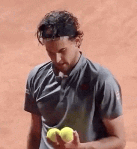 Dominic Thiem Holding Tennis Balls GIF
