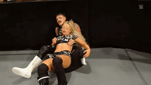 Dominik Mysterio Hugging Liv Morgan GIF