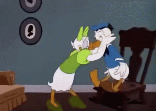 Donald Duck And Daisy Duck Are Hugging In A Cartoon . GIF