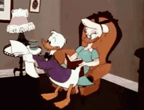 Donald Duck And Daisy Duck Are Sitting In A Chair Reading A Book GIF