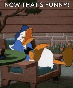 Donald Duck Sitting in Chair With Legs Crossed