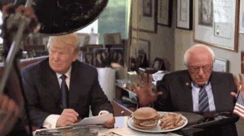 Donald Trump and Bernie Sanders Sitting at Table With Hamburger and Fries