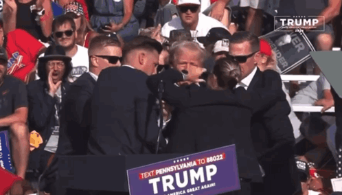 Donald Trump Escorted By Many Men GIF