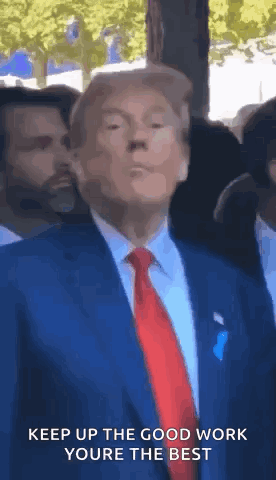 Donald Trump in Blue Suit and Red Tie Making Face