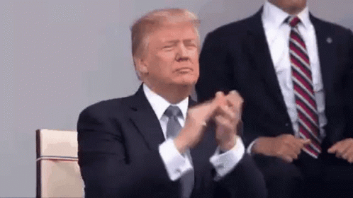 Donald Trump Is Applauding While Sitting In A Chair . GIF