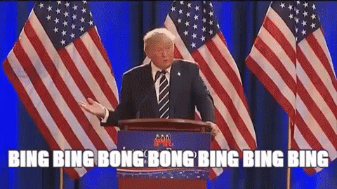 Donald Trump Is Giving A Speech At A Podium In Front Of American Flags GIF