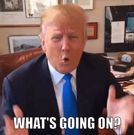 Donald Trump Is Wearing A Suit And Tie And Making A Funny Face While Sitting At A Table . GIF
