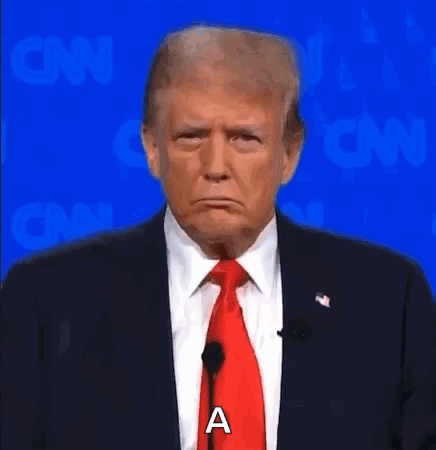 Donald Trump Is Wearing A Suit And Tie And Making A Sad Face While Standing In Front Of A Microphone . GIF