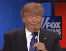 Donald Trump Making Funny Face Holding Microphone in Front of Fox News Sign